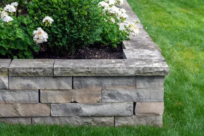 Garden bed with raised stone border