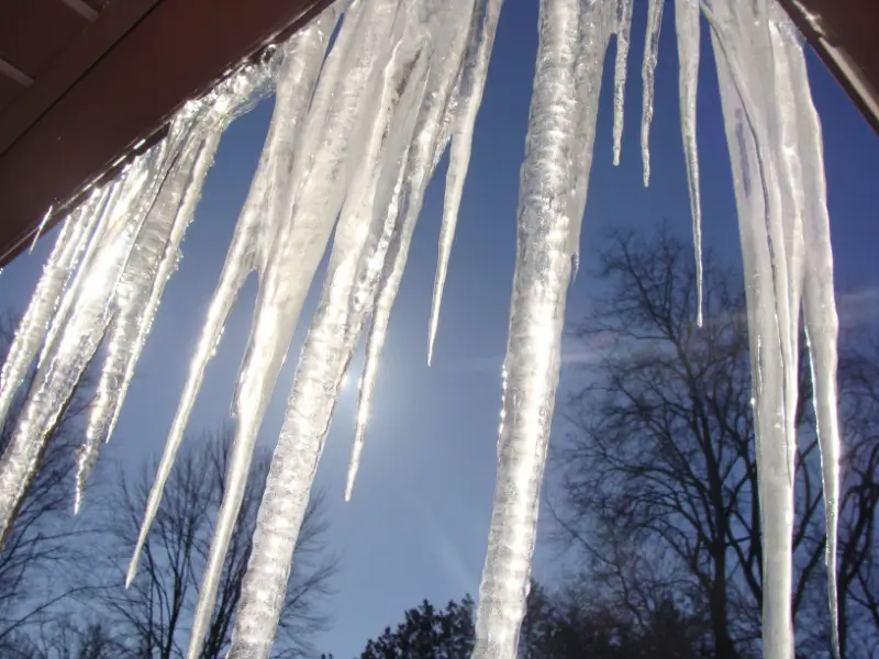 Icicles hanging from the roof of a house