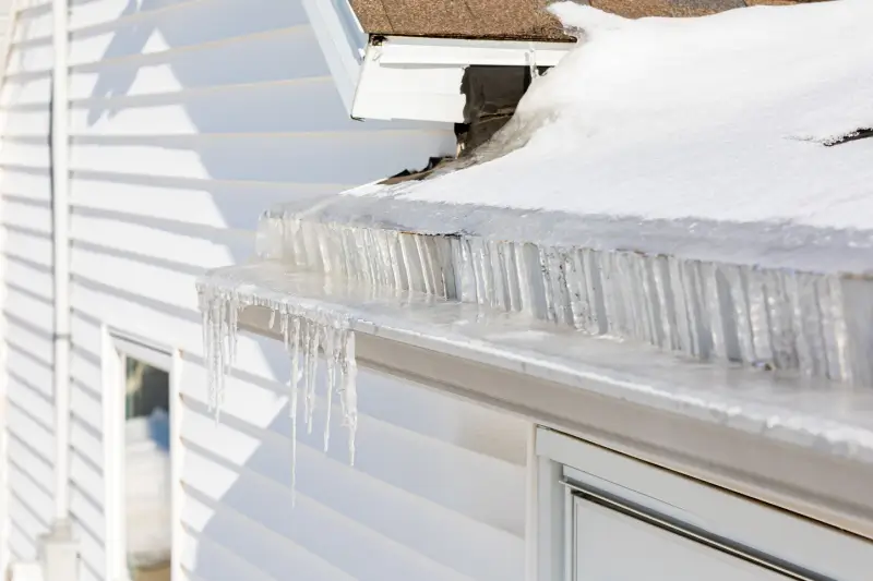 Icicles hanging from gutter on a roof