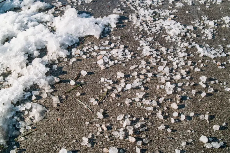 Rock salt on a driveway for ice melting