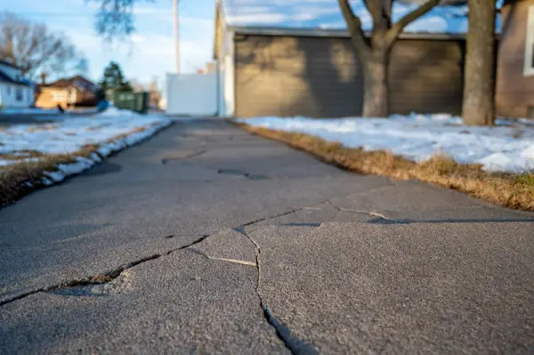 Frost heave cracks on residential driveway
