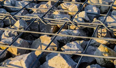 rocks in a metal cage