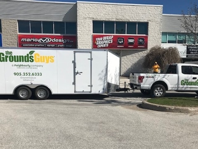 The Grounds Guys leaving for work